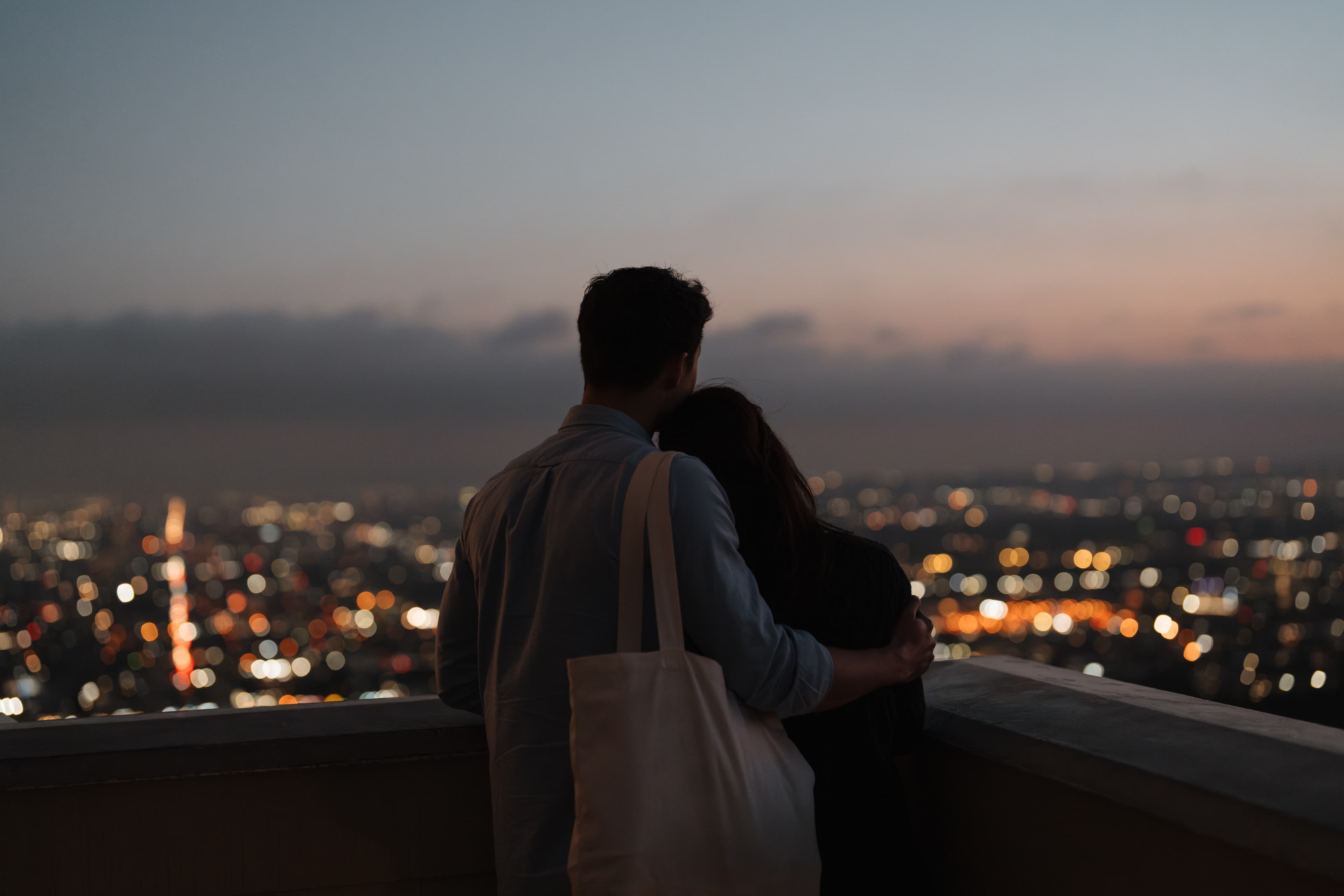 Couple enjoying city view at night